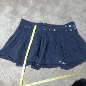 Tripp Pleated Skirt Grommet Detail